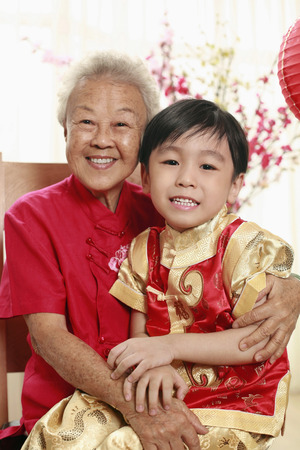 Senior woman and boy posing for the cameraの写真素材