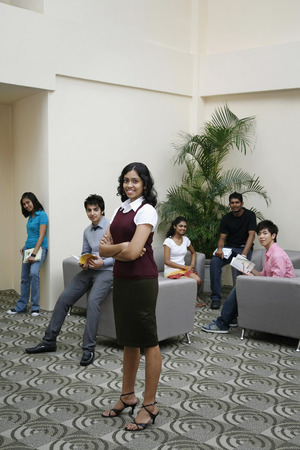 Men and women posing for the cameraの写真素材