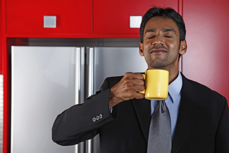 Businessman enjoying a cup of coffeeの写真素材