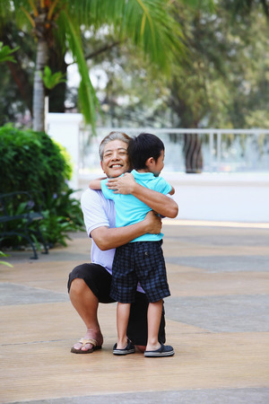 Man hugging his grandsonの写真素材