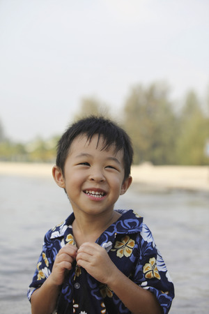 Boy having fun on the beachの写真素材