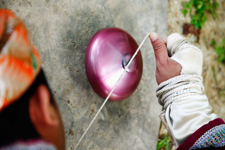 Man spinning a top