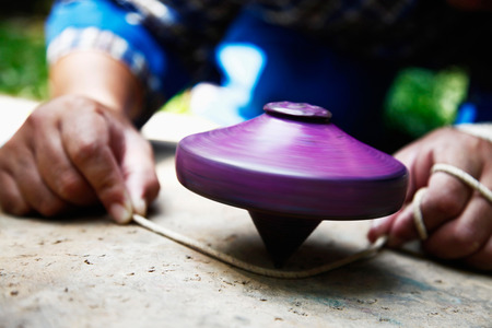 Man spinning a top