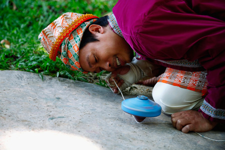 Man spinning a topの写真素材