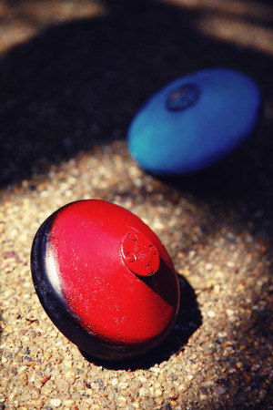 Blue and red tops on the ground