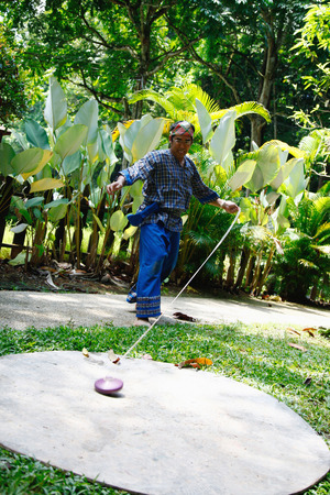 Man spinning a topの写真素材