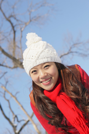 Woman in warm clothing smilingの写真素材