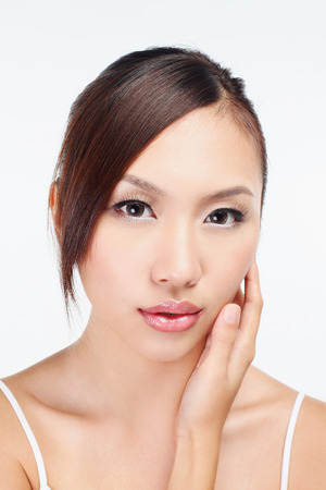 Woman touching her faceの写真素材