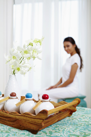 Hotel toiletries, woman sitting in the backgroundの写真素材