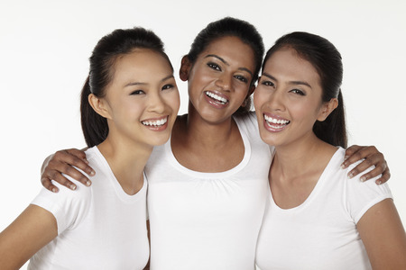 Three happy women smilingの写真素材