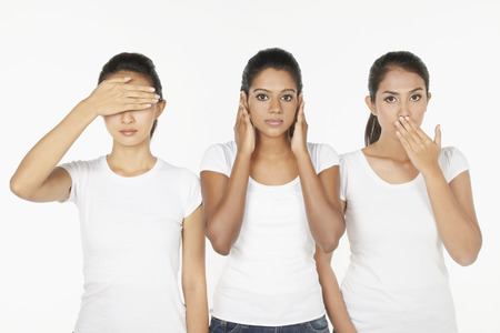 Women portraying the quote, 'See No Evil, Hear No Evil, Speak No Evil'の写真素材
