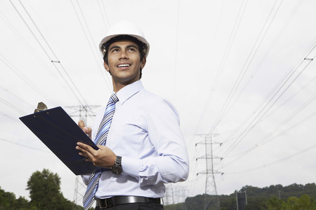 Young businessman holding a clipboardの写真素材