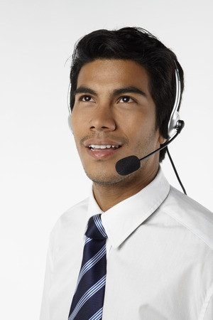 Young businessman wearing headsetの写真素材