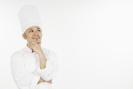 Asian chef thinkingの写真素材