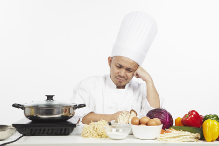 Asian chef in doubtの写真素材