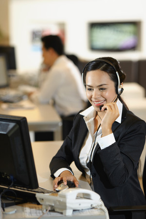 Businesswoman wearing headsetの写真素材