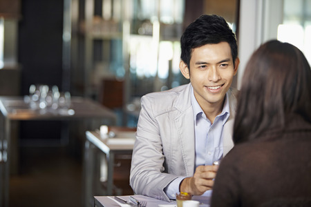 Man and woman in a restaurantの写真素材