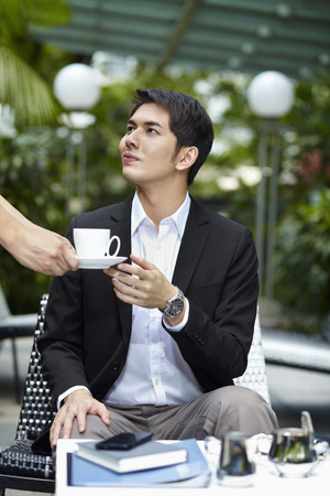 Businessman holding a coffee cupの写真素材