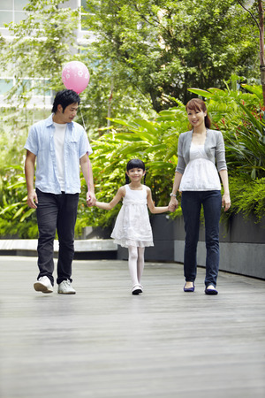 Family walking hand in handの写真素材