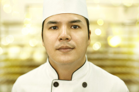 Man in chef uniform looking at the cameraの写真素材