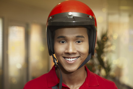 Man with helmet smiling at the cameraの写真素材