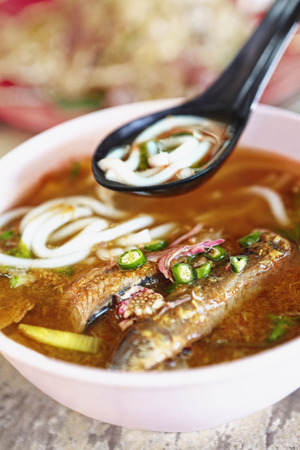 A bowl of asam laksa noodlesの写真素材