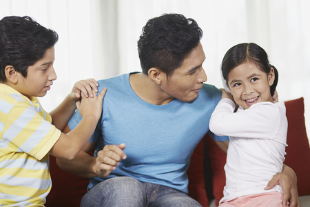 Father talking to his childrenの写真素材