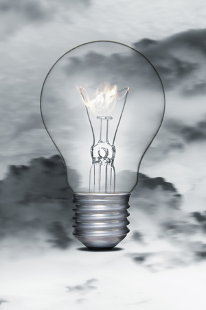 Burning flame in a light bulbの写真素材