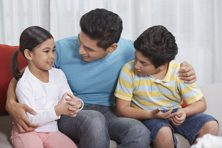 Father talking to his childrenの写真素材