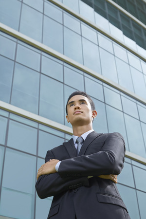 Cheerful businessman thinkingの写真素材