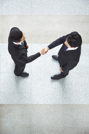 Businessmen shaking handsの写真素材