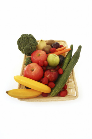 A basket of fruits and vegetablesの写真素材