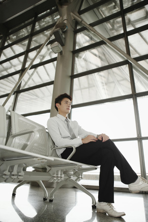 Businessman waiting at the train stationの写真素材