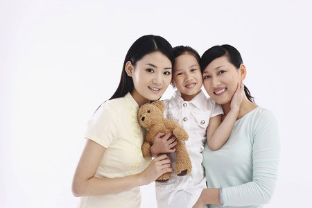 Women and girl posing for the camera