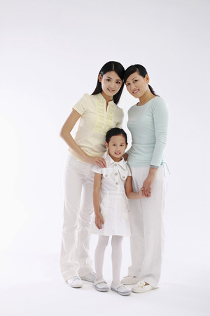 Women and girl posing for the cameraの写真素材