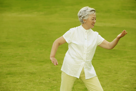 Senior woman exercising in the parkの写真素材