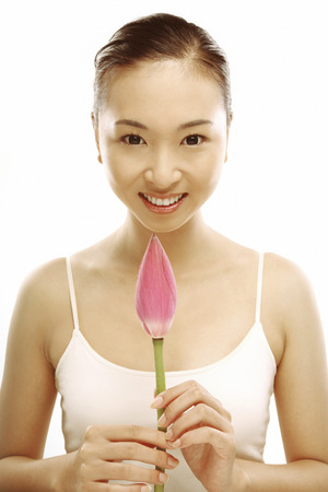 Woman holding a flowerの写真素材
