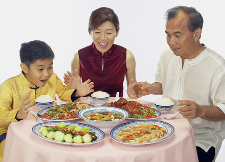 Chinese family having dinnerの写真素材