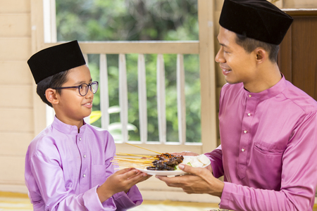 Muslim family feasting during the Eid celebrationの写真素材