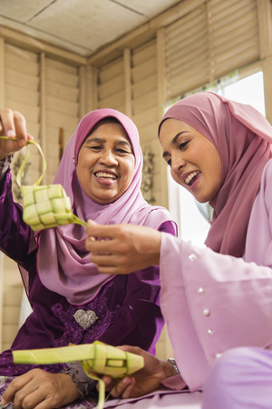 Muslim women with ketupatsの写真素材