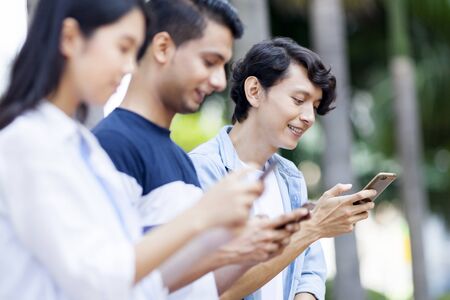 Group of friends on their mobile phone