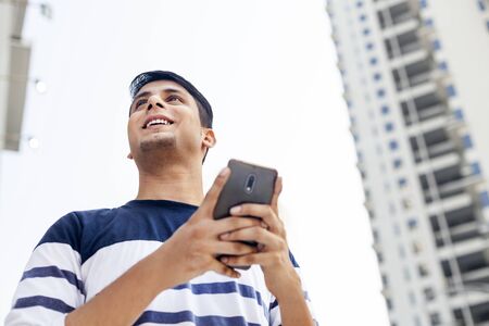 Young man with a mobile phoneの写真素材