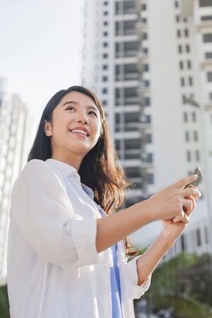 Young woman using a smartphoneの写真素材