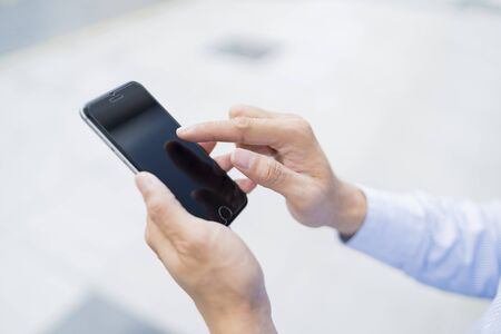 Close up of a person using a phoneの写真素材