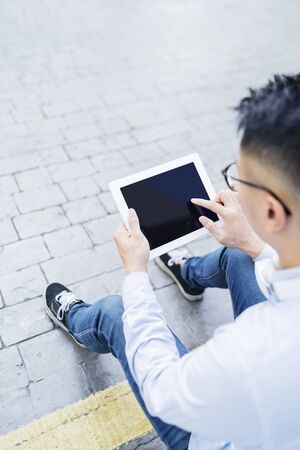 Man using a digital tabletの写真素材