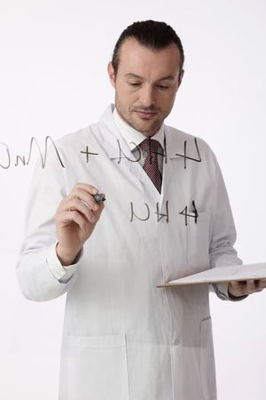 Scientist writing on a glass wall