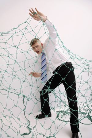 Man trapped under netの写真素材