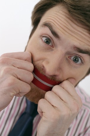 Man with zipper over his mouthの写真素材