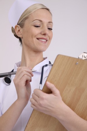 Nurse writing reportの写真素材