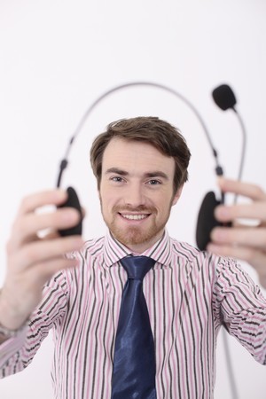 Man holding headsetの写真素材